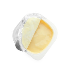 Plastic cup with fruit yogurt on white background