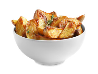 Bowl with tasty potato wedges on white background