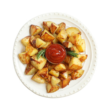 Plate with tasty potato wedges and tomato sauce on white background