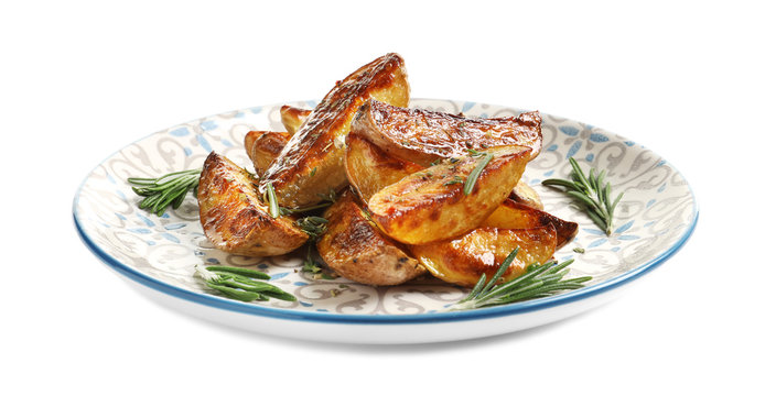 Plate with tasty potato wedges on white background