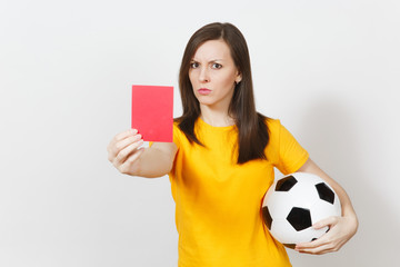 European serious severe young woman, football referee or player in yellow uniform showing red card,...