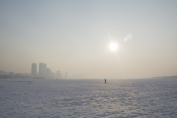 lonely wanderer on frozen lake