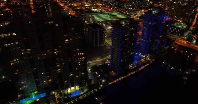 Aerial drone video Miami Beach Florida buildings illuminated night