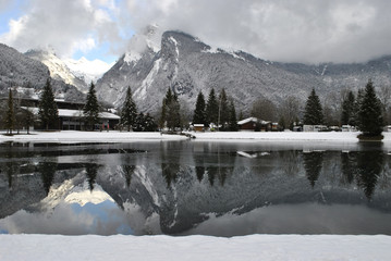reflection of mountains in the lake in Samoens village in France