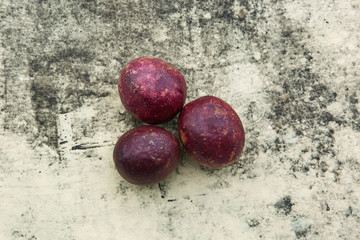 Fresh tropical Passion fruits on stone background