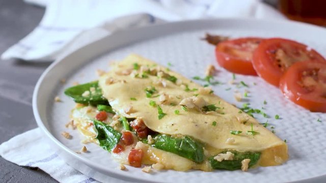 Omelet with vegetables on a plate.