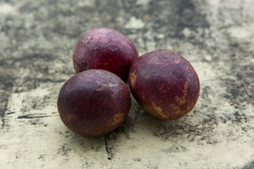 Fresh tropical Passion fruits on stone background