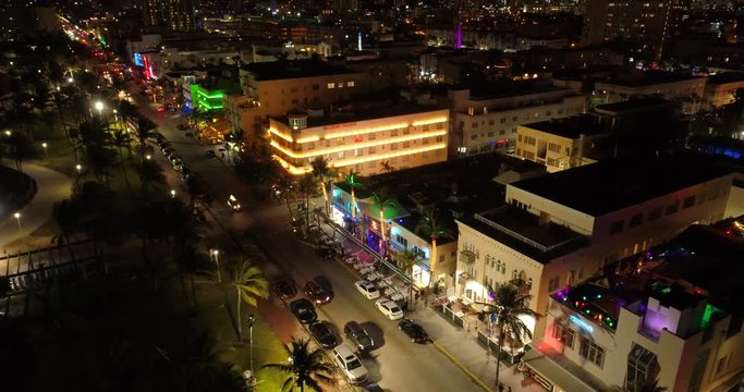 Aerial night flyover Miami Beach Ocean Drive