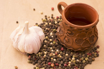Fugural still life photo image of pile of spices, garlic, craft paper and pepper balls