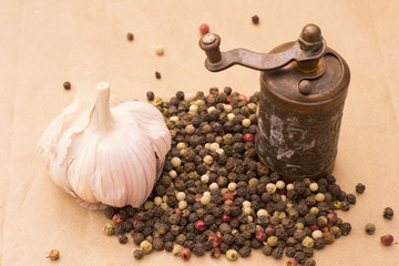 Fugural still life photo image of pile of spices, garlic, craft paper and pepper balls