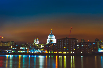 Fototapeta na wymiar thames river at night with sant pauls church in the middle