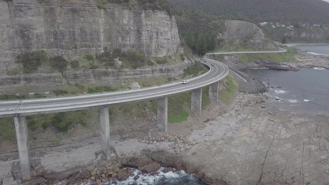 Card driving Over Seacliff Bridge in Australia