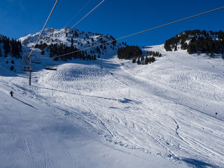 Fototapeta na wymiar MERIBEL, FRANCE - JANUARY 2018: the white slopes in the Alps. Ski resort of Meribel, France. Sunny day