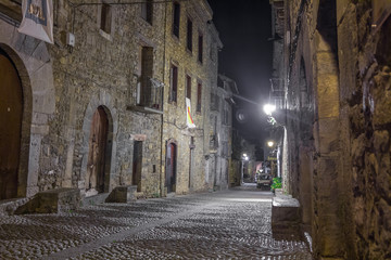 Ainsa medieval village of the Pyrenees with beautiful stone houses at night, Huesca, Spain