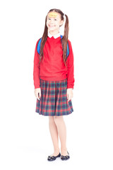 Fototapeta premium Asian female elementary student in school uniform posing on white background