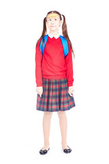 Fototapeta premium Asian female elementary student in school uniform posing on white background