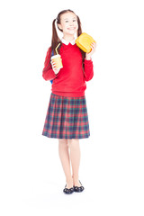Portrait of Asian schoolgirl in uniform holding lunchbox and paper cup with drinking straw