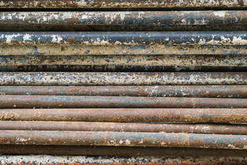 Old rusted iron tubes background. overlap and layer.