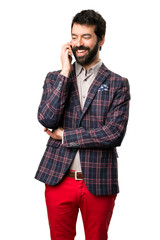Fototapeta premium Well dressed man talking to mobile on white background