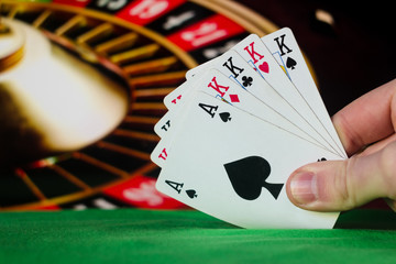 Four of a kind poker cards combination on blurred background casino luck fortune card game