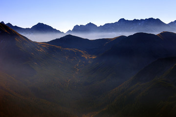 Poland, Tatra Mountains, Zakopane - Wierchcicha Valley and Cichy Wierch, Zadnia Garajowa Kopa peaks with High Tatra in background