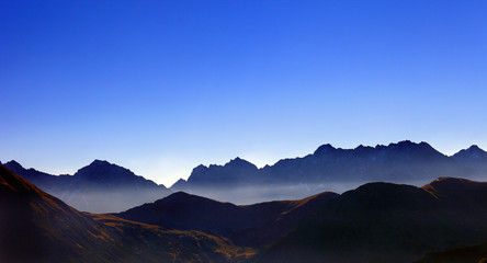 Poland, Tatra Mountains, Zakopane - Wierchcicha Valley and Cichy Wierch, Zadnia Garajowa Kopa peaks with High Tatra in background