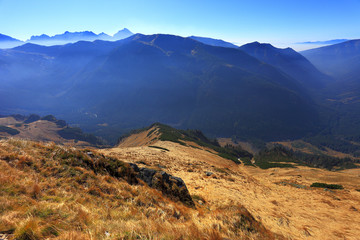 Fototapeta na wymiar Poland, Tatra Mountains, Zakopane - Wierchcicha Valley and Cichy Wierch peak with High Tatra in background