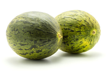 Two melons Piel de Sapo (Santa Claus Christmas variety) isolated on white background green striped outer rind.