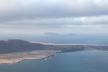 Mirador del Río, Lanzarote / Spain, January 24 2018: View of the East end of La Graciosa from the Mirador del Río with the Isla de Alegranza on the background