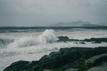 Waves breaking on rock on the coast of Baiona, Galicia Spain