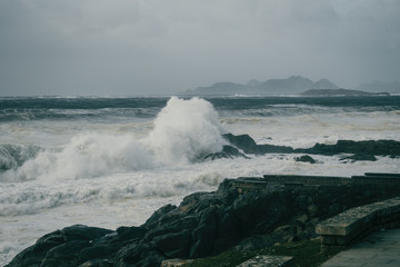 Waves breaking on rock on the coast of Baiona, Galicia Spain