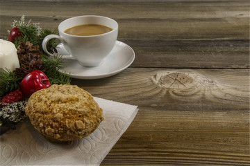 Coffee Cup on wooden table with a wreath and cookie oriented to the Left