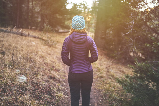 A Young Woman Hiking On A Trail In The Rocky Mountains Of Colorado