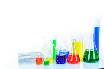 Laboratory glassware with colorful chemical reagent in research laboratory 
