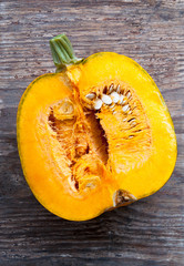 top view on orange pumpkin with seeds