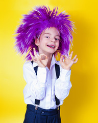 A little boy in a funny purple wig makes the gesture okay.