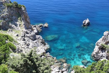 Greek Island - Corfu (Kerkyra). Summer vibes in Greece. Greek beach. Paleokastritsa sea coast.