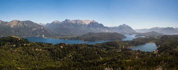 Fototapeta na wymiar Panoramic of the lakes, mountains and forest near Bariloche city in argentinian Patagonia, taken from the Campanario mountain.