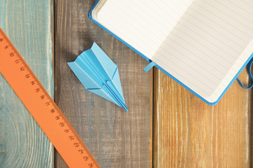 Stationery on colored wooden background