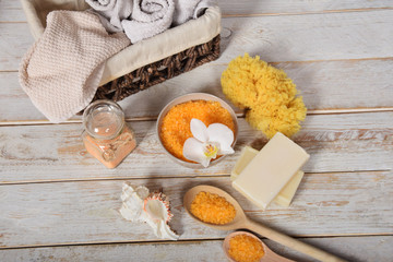 fruit bath salt with olive oil and gray natural soap next to the orchidwith place for text