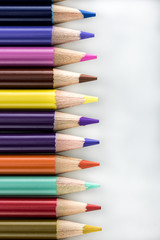 Horizontal colored pointed pencils lined up