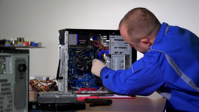 skilled specialist man install ram memory plate to desktop computer