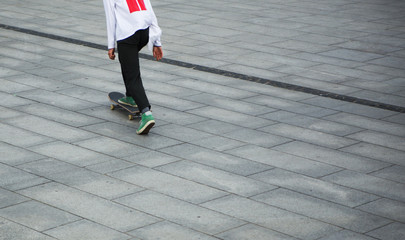Fototapeta na wymiar Young skater boy in yard