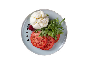 Cheese of the original form with tomatoes on a white background.