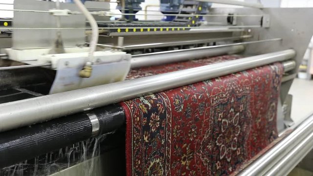 Automatic washing and cleaning of carpets. Industrial line for washing carpets