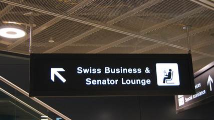ZURICH, SWITZERLAND - MAR 31st, 2015: airport sign to SWISS Business and Senator Lounge inside the terminal building