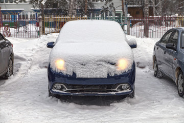 car is covered with snow