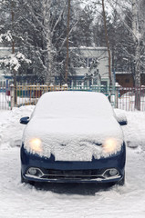 car is covered with snow