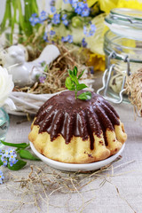 Traditional easter cake with chocolate decorated with buxus twig.