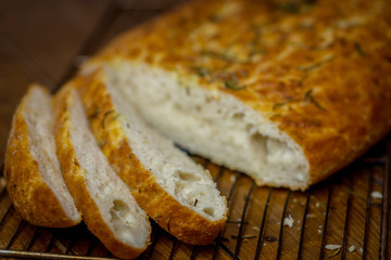 Sliced focaccia on wooden table